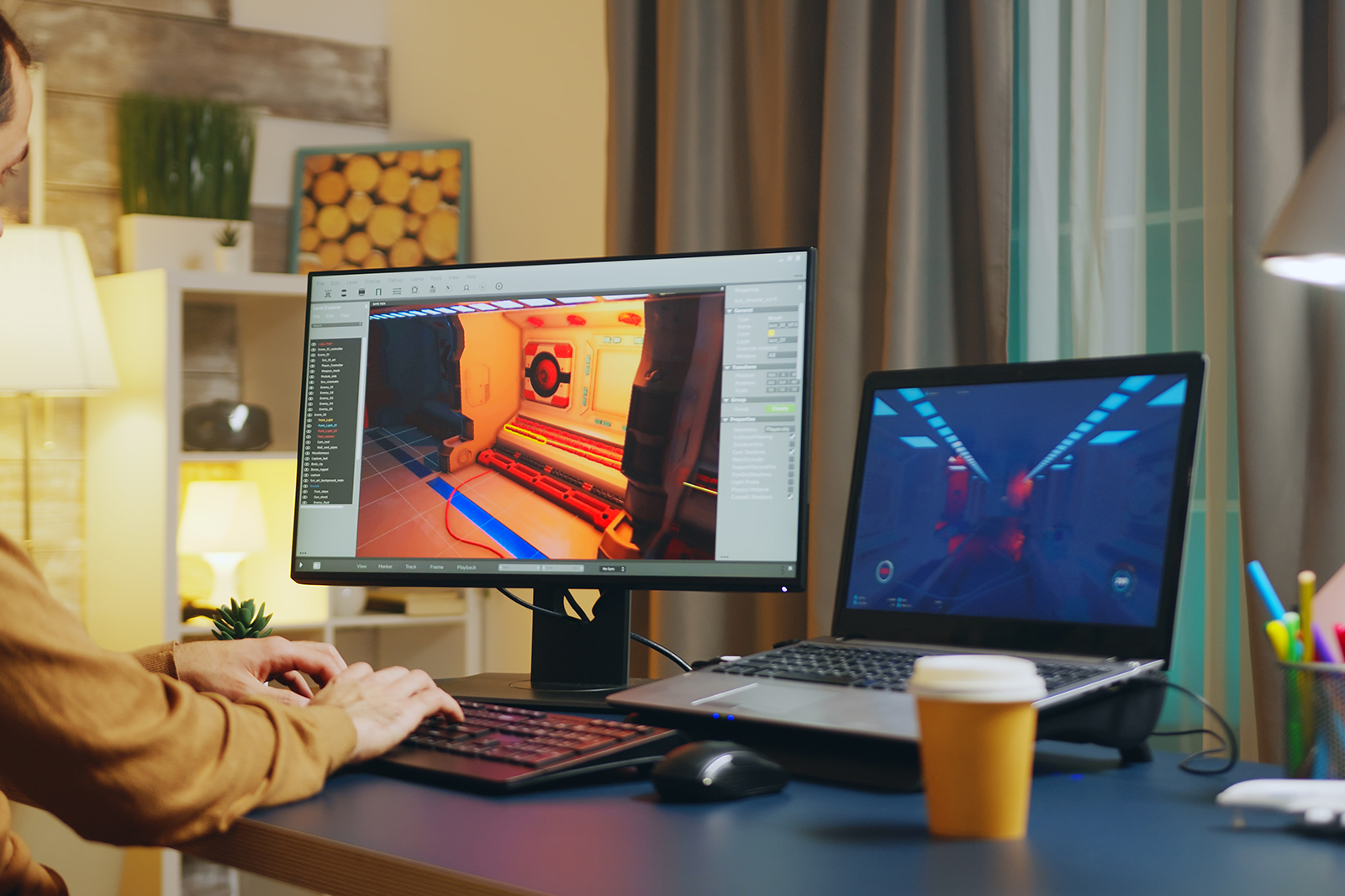male-game-developer-typing-keyboard-while-developing-new-level-game.png